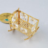 Złota figurka kołyska z kryształkami Swarovskiego 122-0056