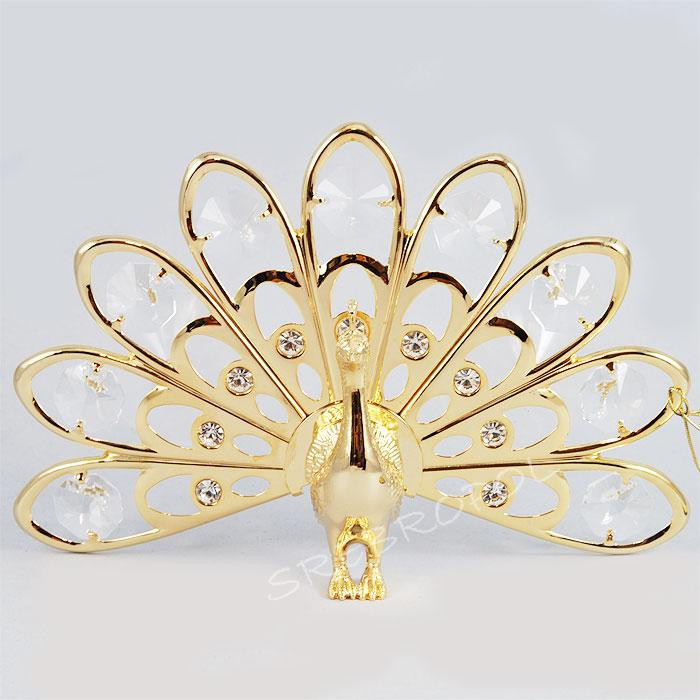 Złota figurka paw na przyssawce z kryształkami swarovskiego 1007481