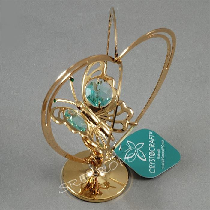 Złota figurka motylek w sercu z kryszałkami swarovskiego
